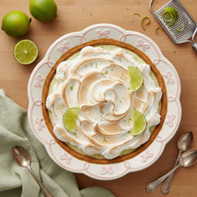 Pie dish with tart, lime wedges, and ribbon-bow trim rim in ballet pink