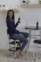 Black retro step stool with padded seat, back, and three tier steps