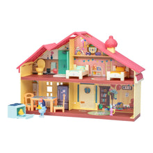Toy playset house exterior view with pink roof, doors, and detailed interior