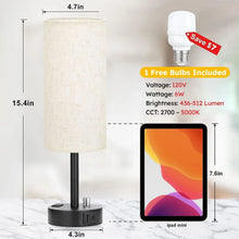 Bedside table lamp with linen shade, black stand, and included bulb