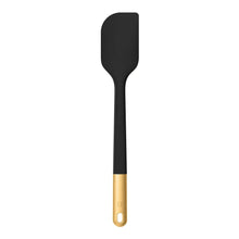 Black silicone spatula with gold handle end and hanging hole