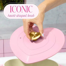 Pink heart-shaped lid with gold heart knob for a heart-shaped Dutch oven