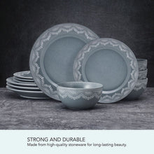 Blue stoneware dinnerware set with white lace trim plates and a serving bowl