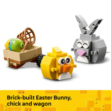 Brick-built LEGO bunny and chick figures with egg basket and wagon on display