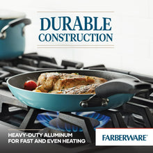 Aqua nonstick frying pan on a gas stove with food and a black stay-cool handle