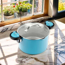 Aqua blue pasta pot with stainless lid and twist-lock handles, on kitchen counter