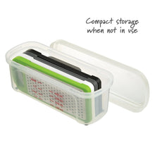 Compact storage container with green grater and black blade assembly for when not in use
