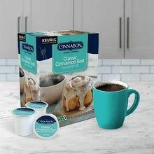 Cinnabon Classic Cinnamon Roll K-Cup pods with coffee mug and pod cups