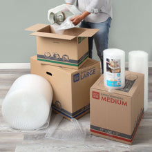 Clear plastic bubble cushion rolls wrapping moving boxes for protection
