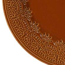 Caramel ceramic rim detail with raised lace floral pattern in curved border