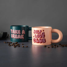 Stoneware mug pair with handles: dark green “Take a Break” and pink “Self Love Club”