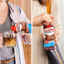 Premier Protein chocolate shake carton held by a person