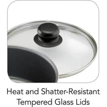 Tempered glass lid with black knob on non-stick pot