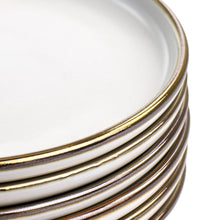 Gold-edged rim on matt white stoneware salad plates, stacked