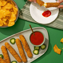 Jalapeno kettle cooked potato chips with red dipping sauce and sliced cucumber