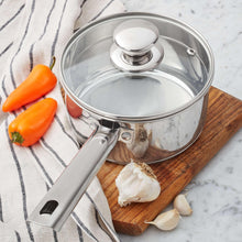 Stainless steel saucepan with clear glass lid and long side handle
