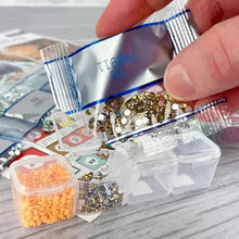Diamond painting kit beads and diamond wax; hand applies wax onto a diamond tool