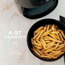 Air fryer basket filled with fries, 4-qt capacity bowl