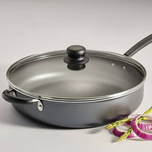 Steel gray covered jumbo cooker with glass lid and black loop handles