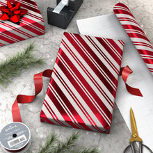 Hallmark candy cane stripe gift wrap on a box with red ribbon