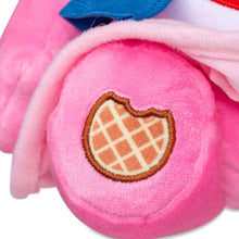 Pink plush pocket with brown waffle badge on the paw area