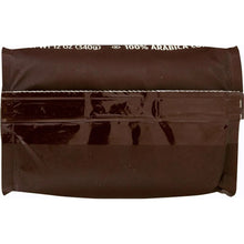 McCafe ground coffee bag, close-up of sealed front seam
