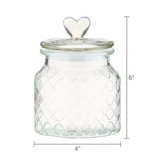 Clear glass jar with heart-shaped lid knob; measures 6 in tall and 4 in wide