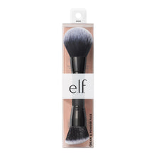 Face brush in retail packaging with black handle and soft gray bristles