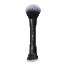 Face brush with black handle and soft gray bristles, round head