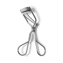 Curved metal eyelash curler with black silicone pad and open U-shaped arms