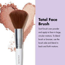 Total face makeup brush with rounded fluffy bristles and silver ferrule.