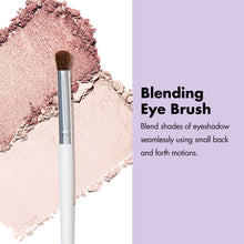 Blending eye brush with short brown bristles and silver ferrule on a white handle