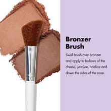 Bronzer brush with dense rounded bristles for sweeping product on cheeks.