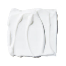 Thick white moisturizer swatch with gel texture