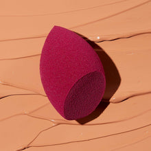 Pink teardrop face sponge with textured surface