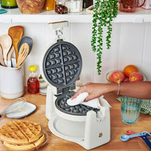 Rotating Belgian waffle maker by Drew Barrymore, white base with open waffle plates