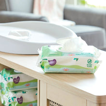Cucumber baby wipes pack with wipes pulled from the dispenser