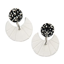 White clay disc earrings with black leopard print centers and silver hooks
