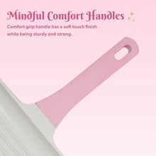 Pink grill pan handle with comfort grip cutout on white ceramic nonstick base