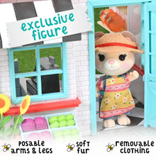 Mini doll figure in a colorful dress inside a blue dollhouse doorway