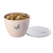 Blush plastic mixing bowl with airtight lid, filled with bread rolls, butterfly decal