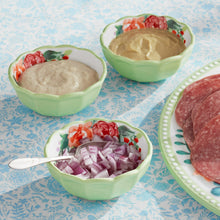 Ceramic dip bowls and serving tray with floral design, filled with dips and toppings