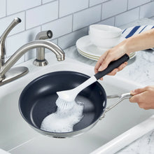 Angled sink brush with white bristle head and black soft-touch handle