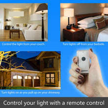 White wall switch with snap-on remote in hand; remote has clear cover and black button.