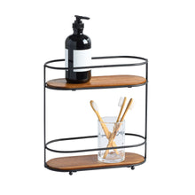 Two-tier vanity organizer with black frame, wood shelves, and pump bottle on top