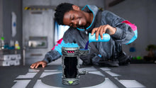 Lab mutator action figure playset with gray canister and blue base, on display
