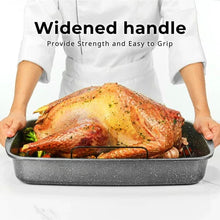 Wide-handled speckled roasting pan with nonstick surface, holding roast chicken