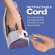 Steam iron with retractable cord base and handle