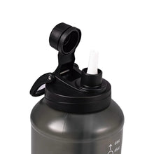 Translucent black water bottle lid with straw opening and flip chug cap