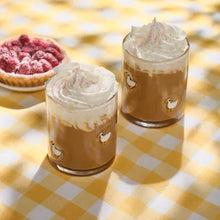 Charm drinking glasses with whipped tops and small goose motifs